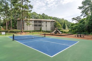tennis court and play ground at the pet friendly apartment in clarkston the ellis