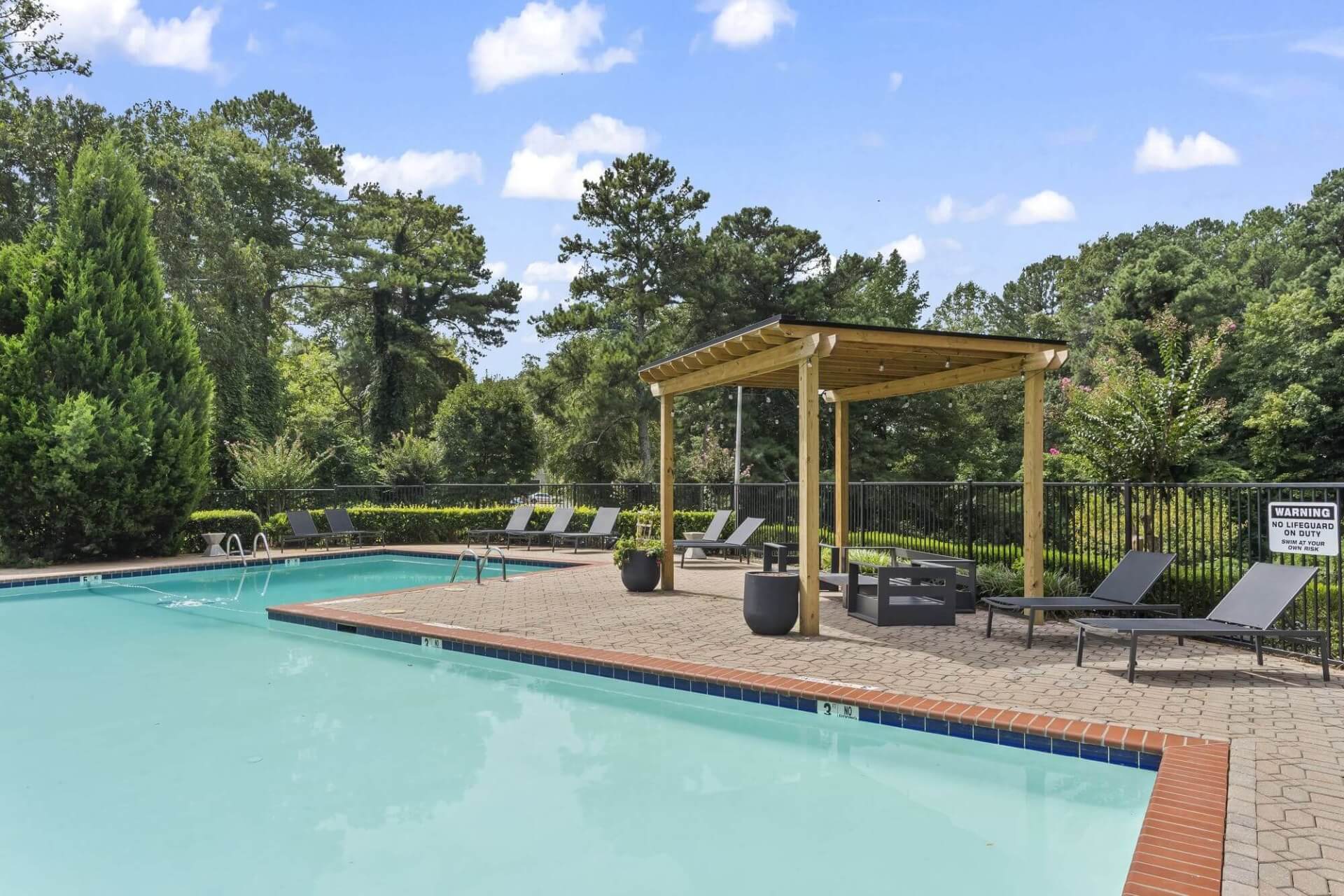 the pool lounge at the ellis clarkston apartments for rent